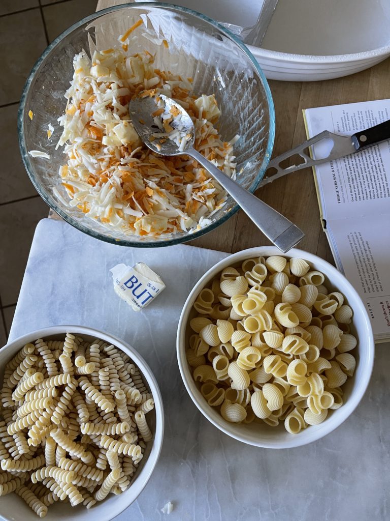 Overhead shot of the shredded cheese mixture and the two noodle types that were up for debate