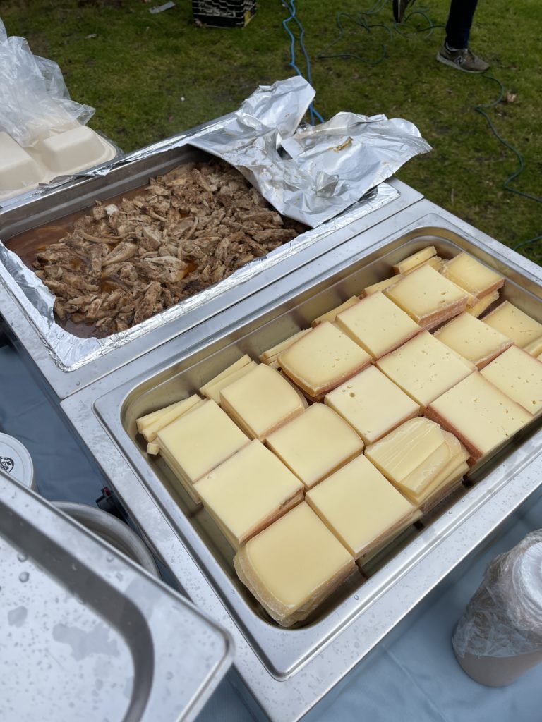 Prepped slices of raclette cheese seen next to chicken shwarma from Epicure MV