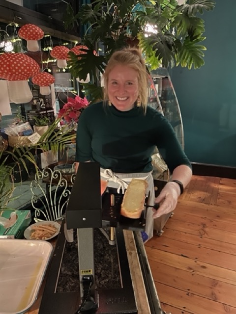 Morgen smiling with her new raclette machine after a successful raclette night at S&S Kitchenette