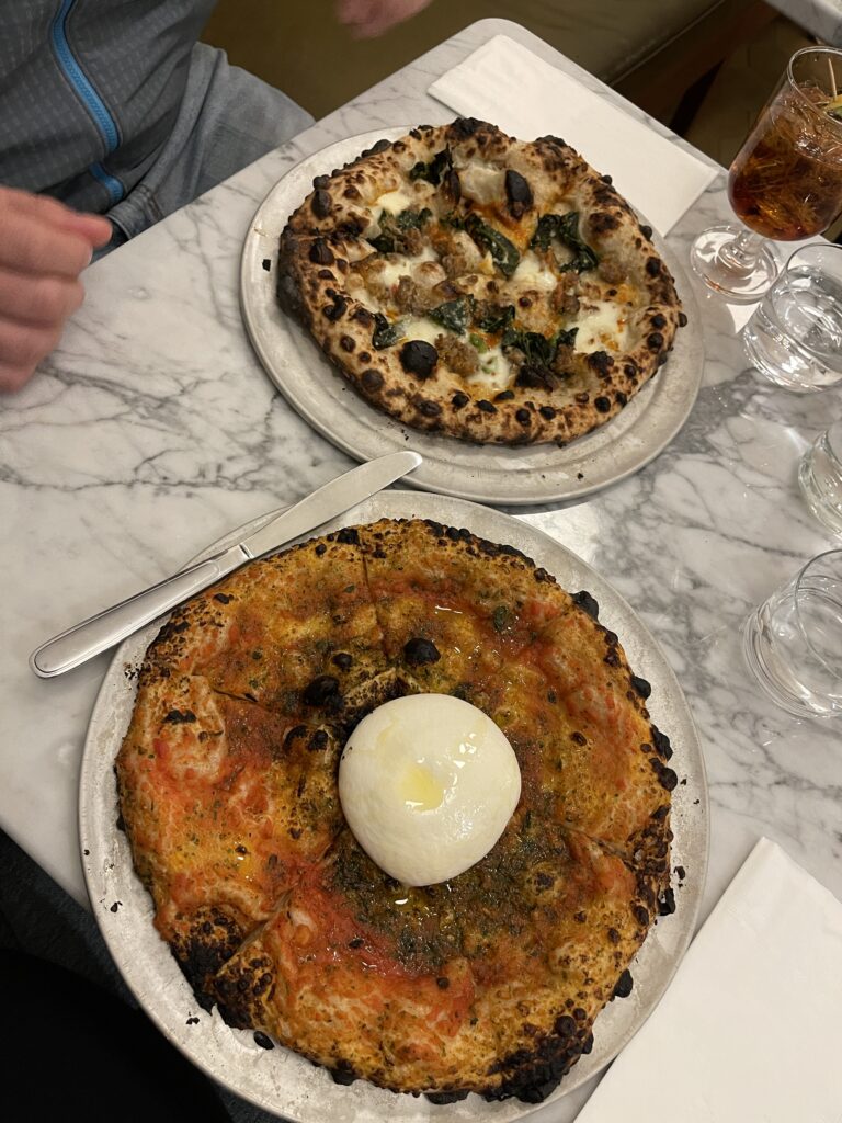 Two of the delicious pizzas from Quanto Basta - one has a whole blob of burrata!
